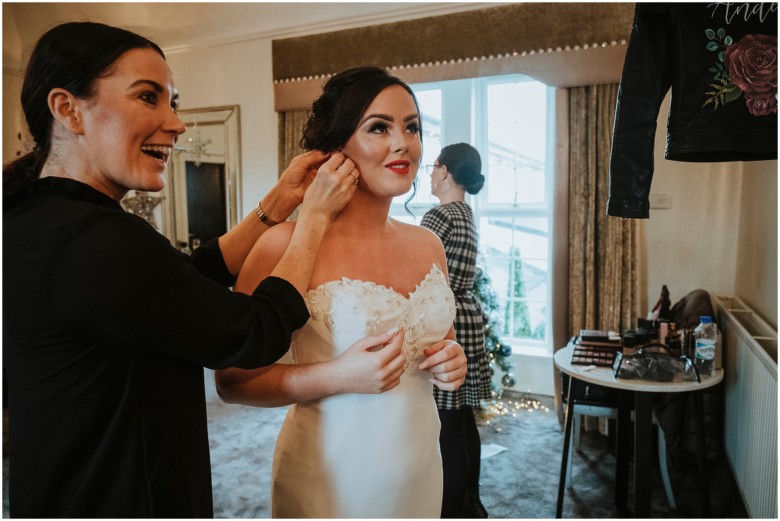 bride and her bridesmaids getting ready