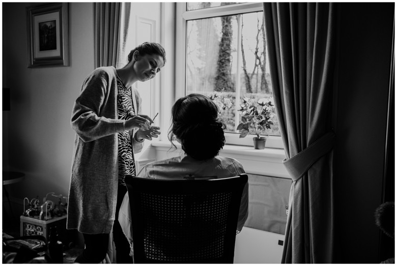 bride and her bridesmaids getting ready for the wedding