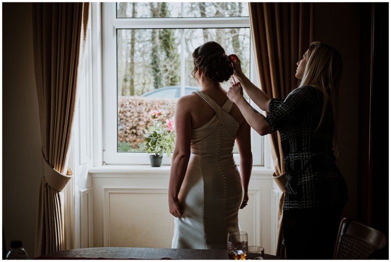 bride and her bridesmaids getting ready for the wedding